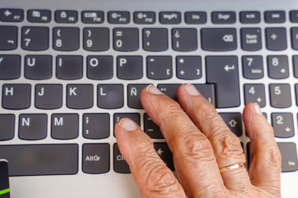 person typing on computer